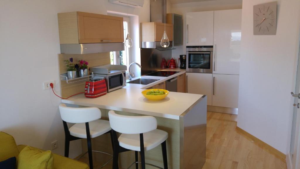 Kuchyň nebo kuchyňský kout v ubytování Apartment AMMIRARE Rab