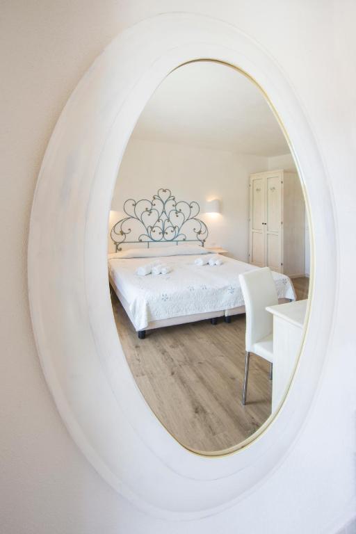 Postel nebo postele na pokoji v ubytování Olbia City Hotel