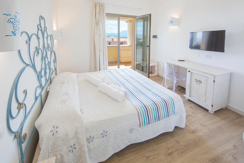 Postel nebo postele na pokoji v ubytování Olbia City Hotel
