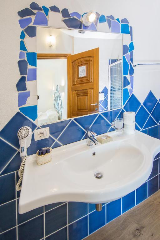 Koupelna v ubytování Olbia City Hotel