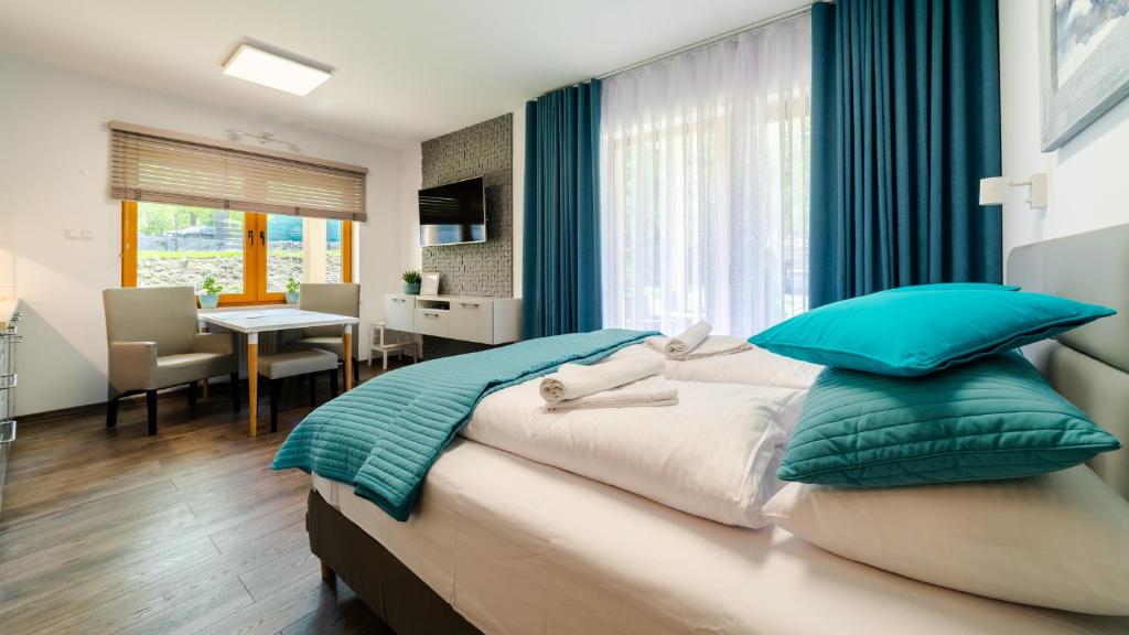 Posteľ alebo postele v izbe v ubytovaní Apartamenty Sun & Snow Sarnia Residence
