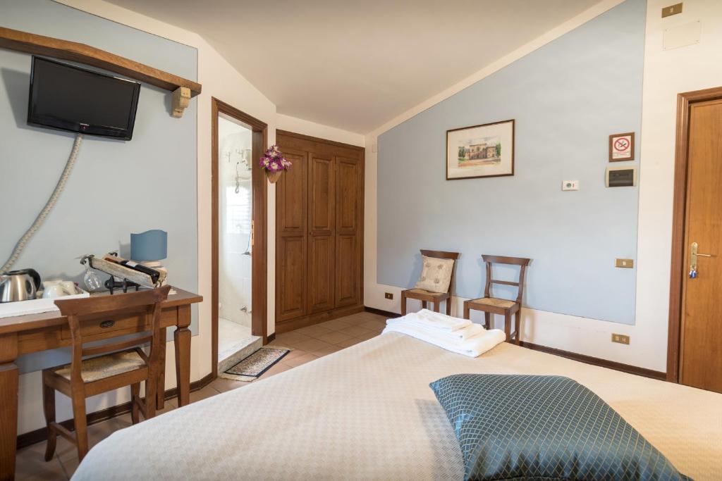 Postel nebo postele na pokoji v ubytování La Piaggia