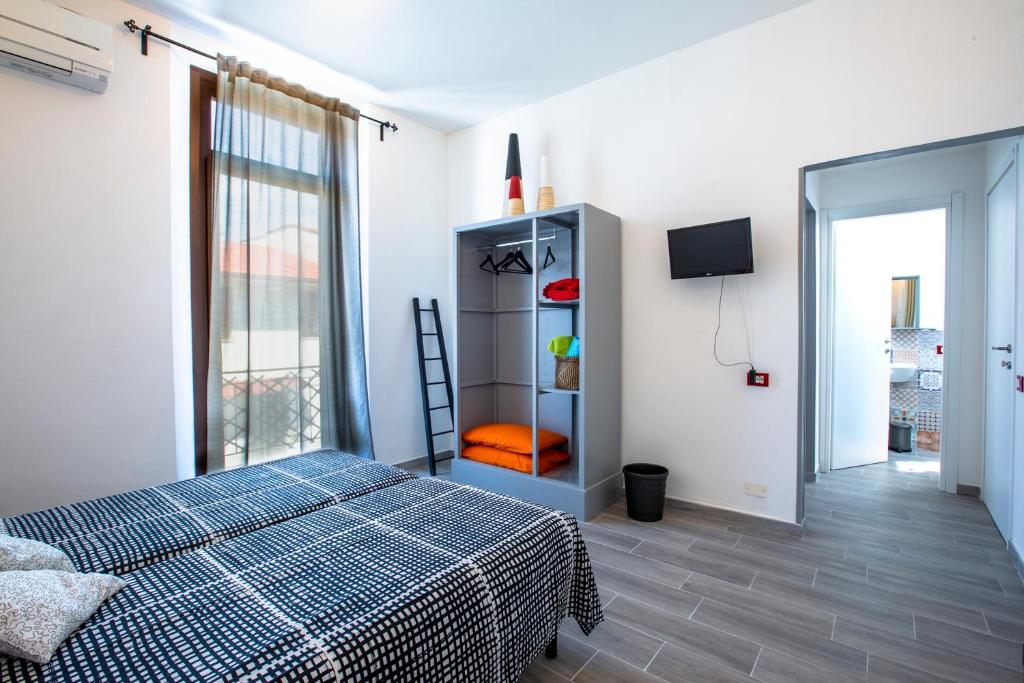 Postel nebo postele na pokoji v ubytování Luigino B&B