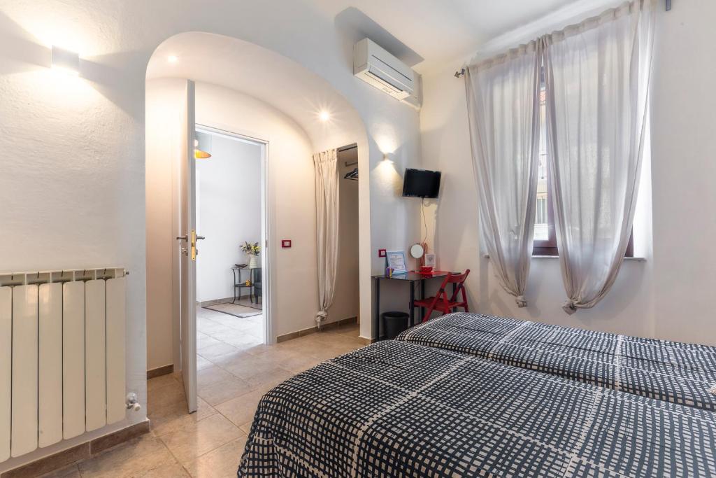Postel nebo postele na pokoji v ubytování Luigino B&B