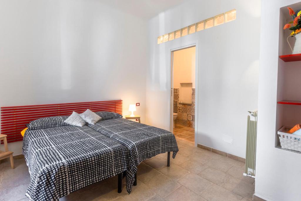 Postel nebo postele na pokoji v ubytování Luigino B&B