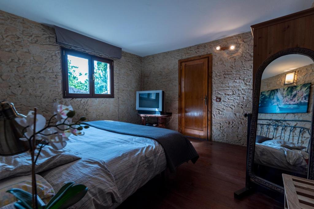 Postel nebo postele na pokoji v ubytování Roque nublo rural houses I