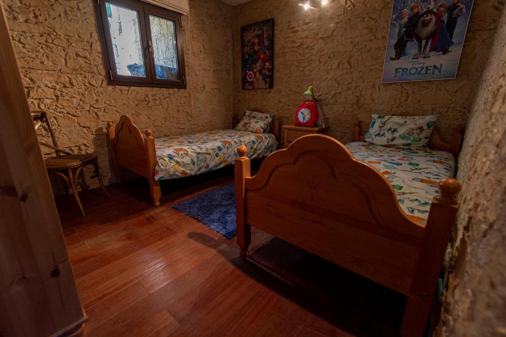 Postel nebo postele na pokoji v ubytování Roque nublo rural houses I