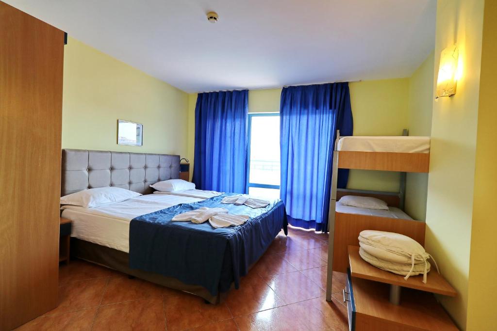 Postel nebo postele na pokoji v ubytování Bora Bora Hotel