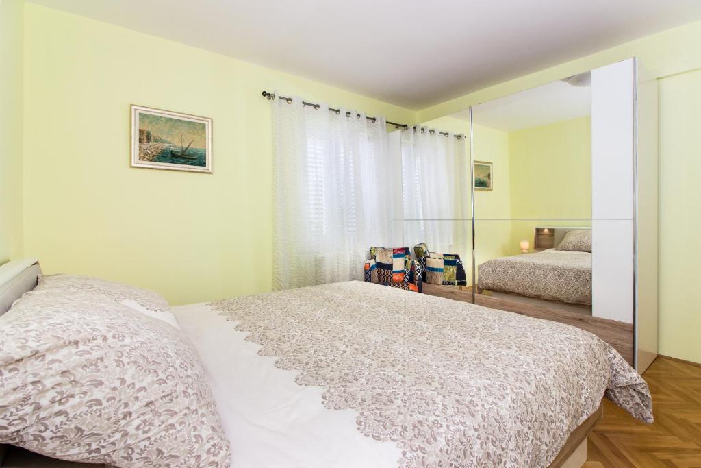 Posteľ alebo postele v izbe v ubytovaní Apartment Fortunella