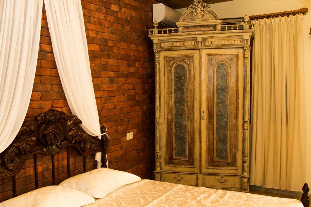 Postel nebo postele na pokoji v ubytování Vintage Art Rooms