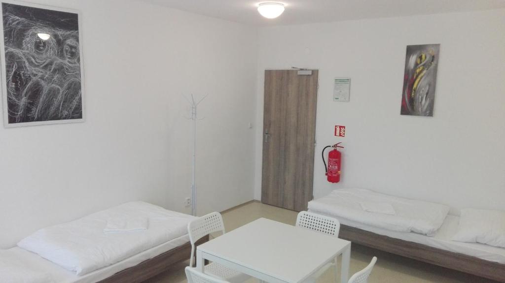 Postel nebo postele na pokoji v ubytování Ubytovna Kubra