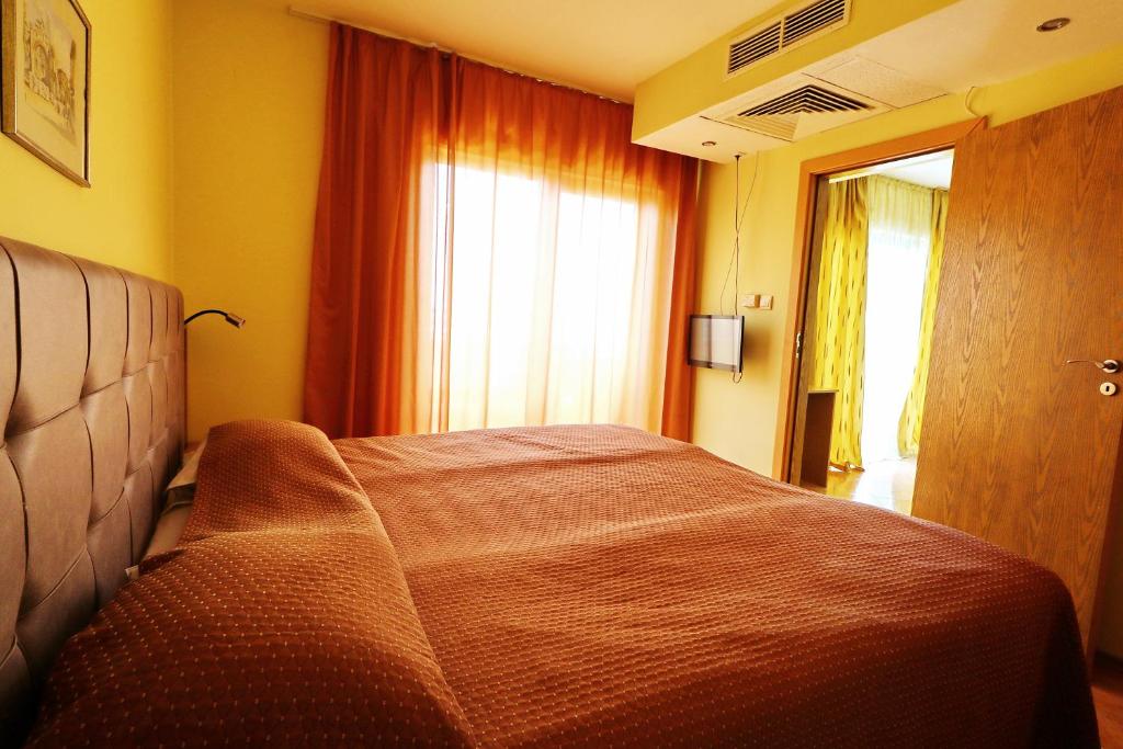 Postel nebo postele na pokoji v ubytování Bora Bora Hotel