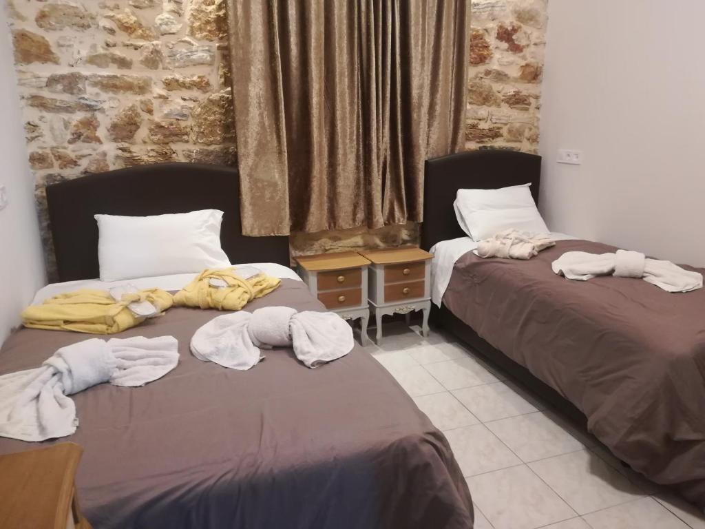 Posteľ alebo postele v izbe v ubytovaní Skourtaniotis spa rooms