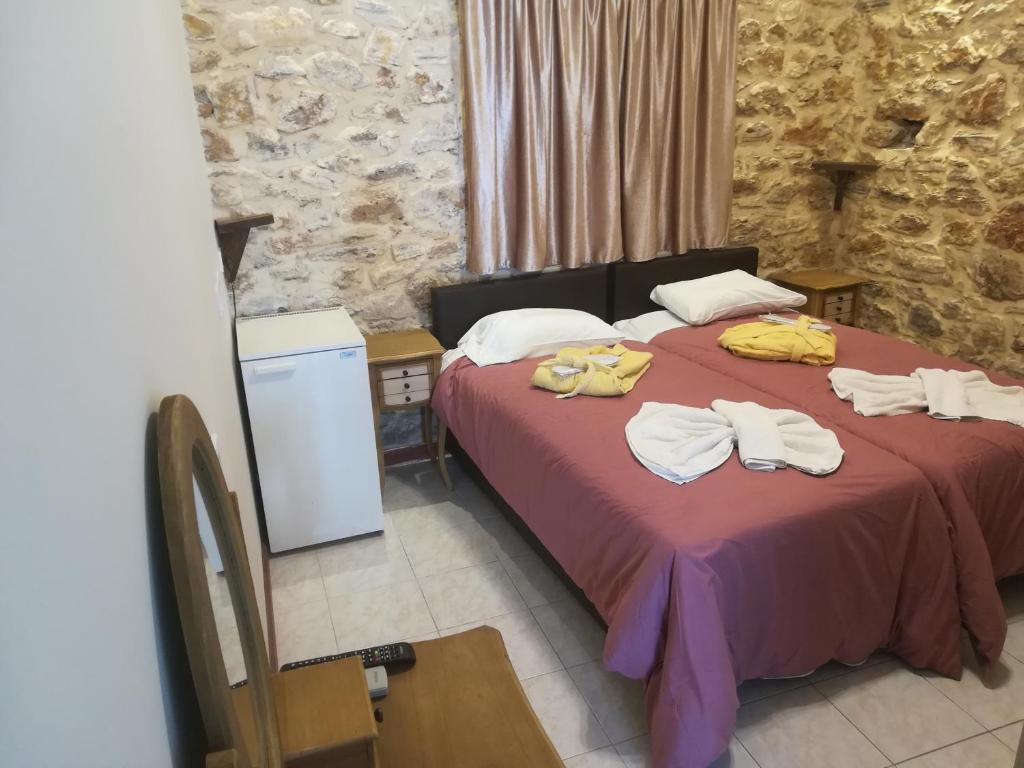 Posteľ alebo postele v izbe v ubytovaní Skourtaniotis spa rooms