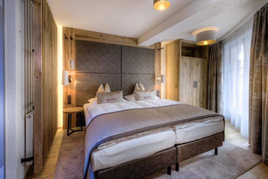 a bedroom with a large bed in a room at Hotel Brigitte in Ischgl