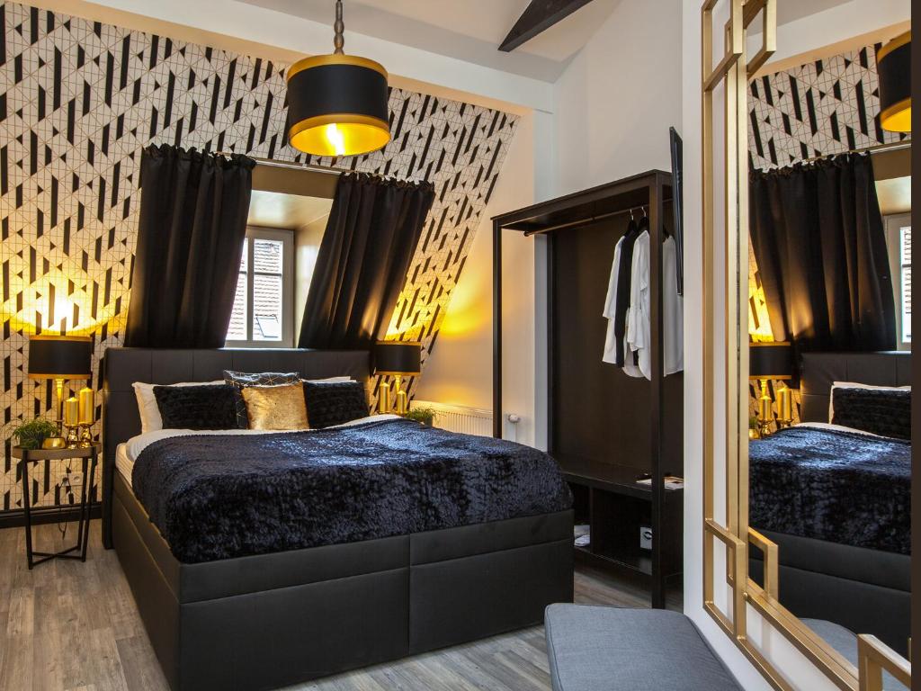 Postel nebo postele na pokoji v ubytování Golden Prague Rooms