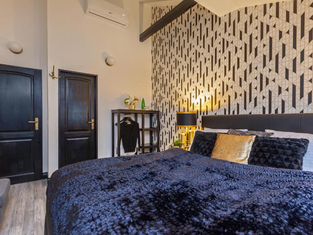 Postel nebo postele na pokoji v ubytování Golden Prague Rooms