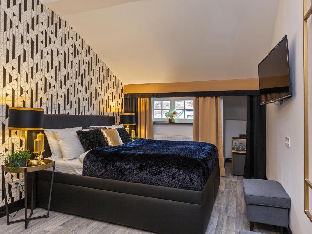 Postel nebo postele na pokoji v ubytování Golden Prague Rooms