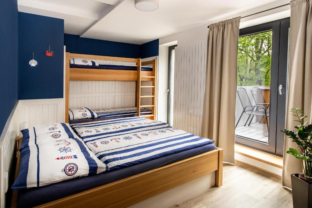Postel nebo postele na pokoji v ubytování Penzion Labska Marina