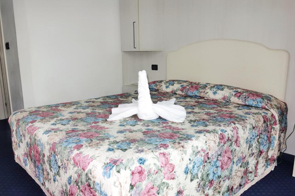 Postel nebo postele na pokoji v ubytování Hotel Tridentum