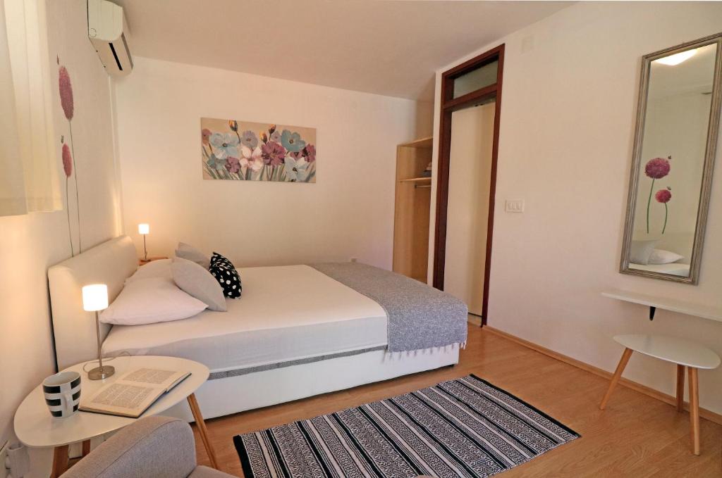 Postel nebo postele na pokoji v ubytování Guesthouse Korkyra Sun