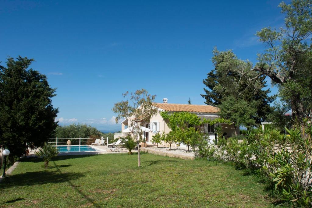 a villa with a swimming pool and a garden at Oleander villa in Kouramaditika
