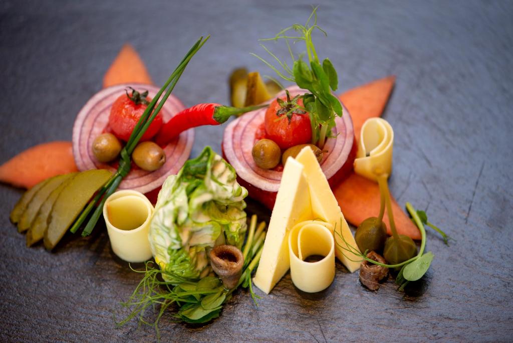 a bunch of vegetables and fruits on a table at Hotel Brigitte in Ischgl