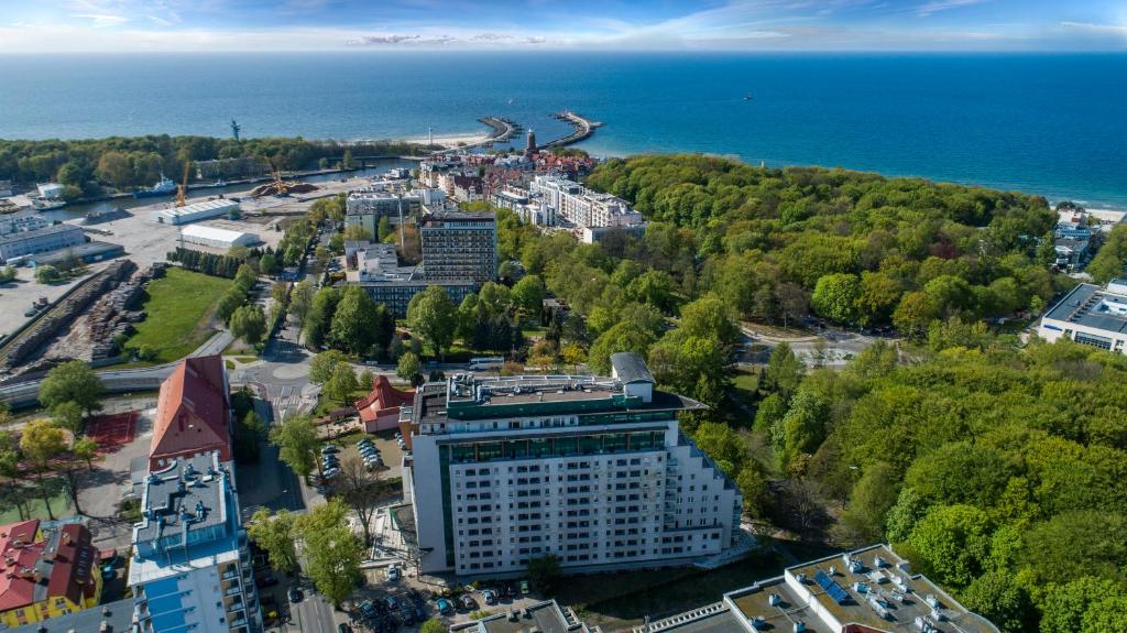 an aerial view of a city and the ocean at Aparthotel Etna in Kołobrzeg