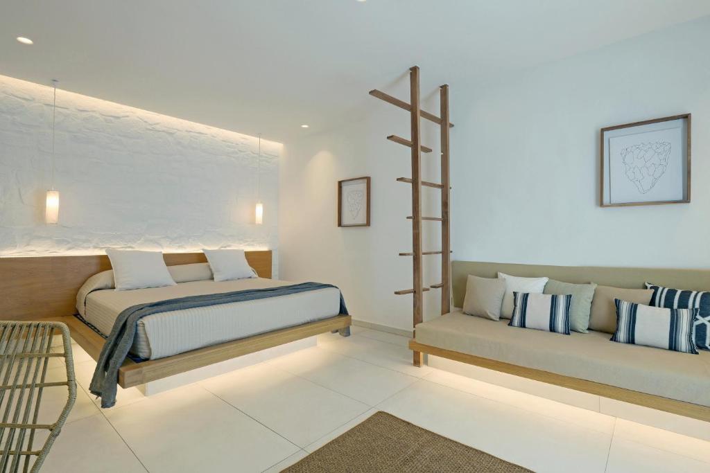 Postel nebo postele na pokoji v ubytování Andronikos Hotel