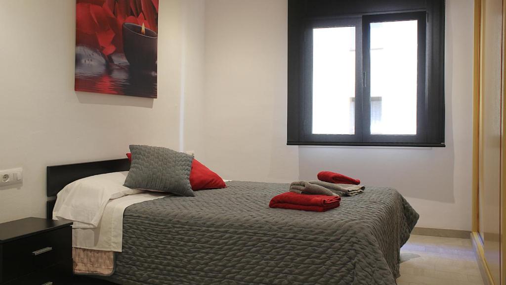 Posteľ alebo postele v izbe v ubytovaní Apartament Margarit