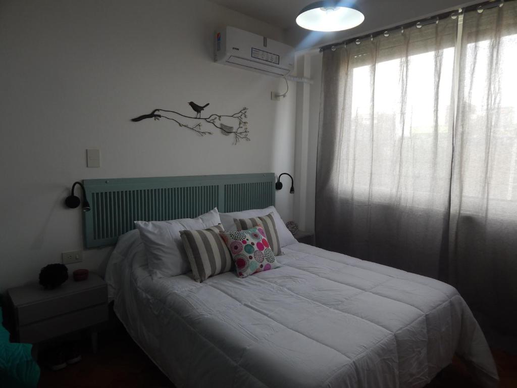 En eller flere senge i et værelse på Apio Studio Centro