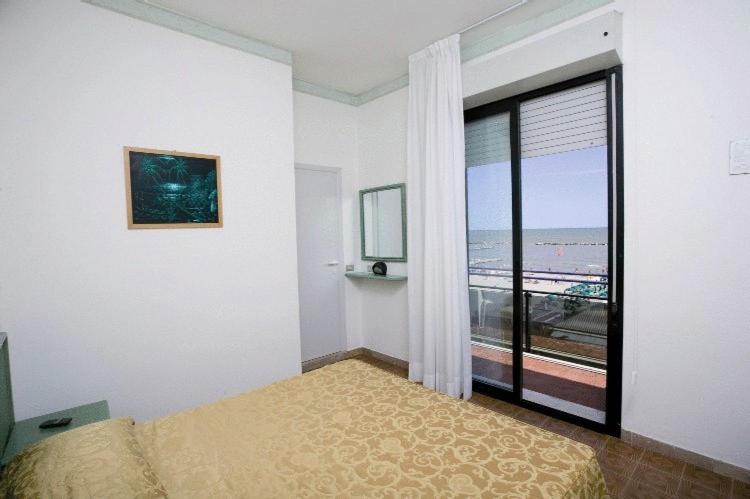 Postel nebo postele na pokoji v ubytování Hotel Iride & Spa
