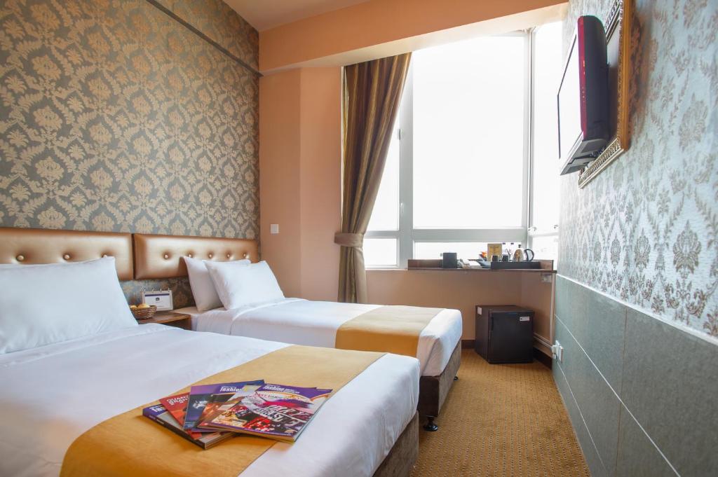 Postel nebo postele na pokoji v ubytování Best Western Hotel Causeway Bay