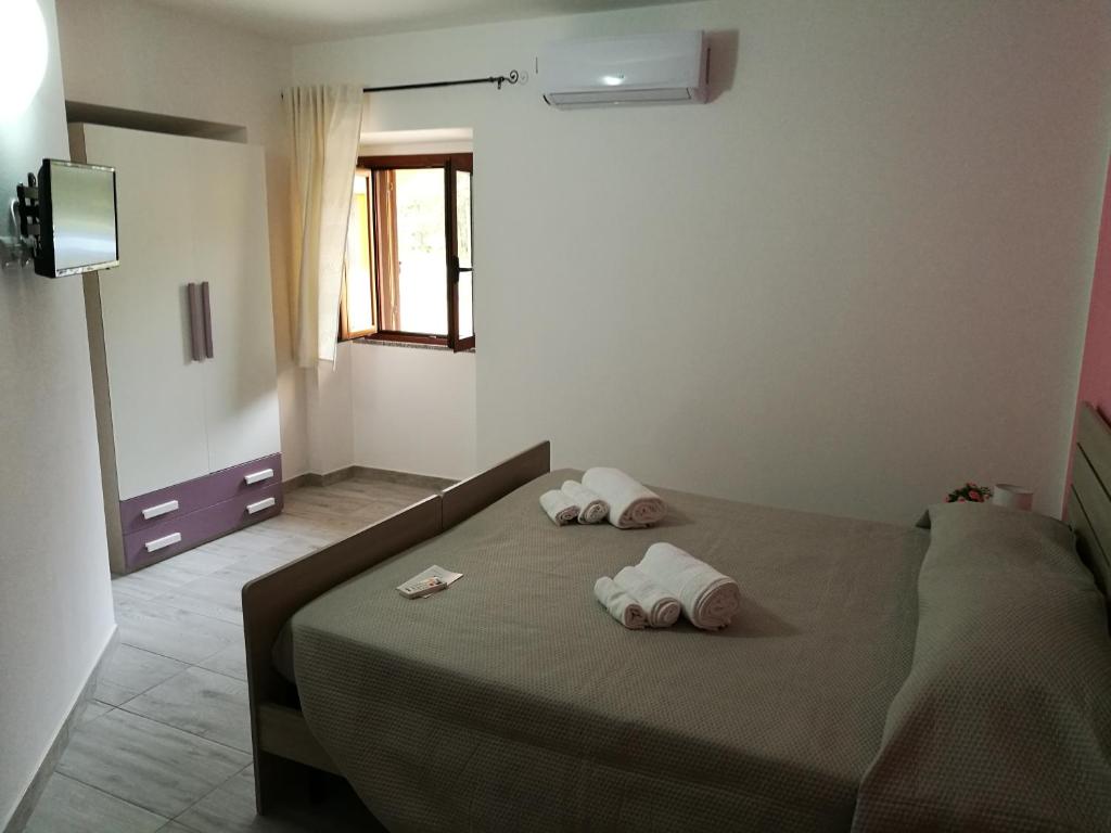 Postel nebo postele na pokoji v ubytování B&b Domo e Nonna