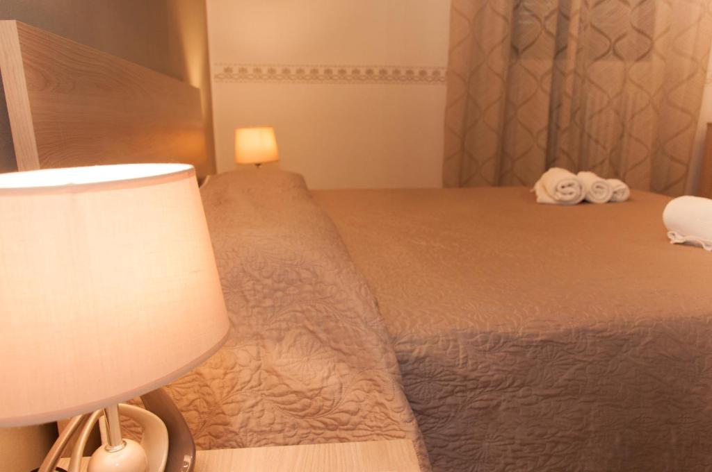 Postel nebo postele na pokoji v ubytování Wish Rooms Lecce