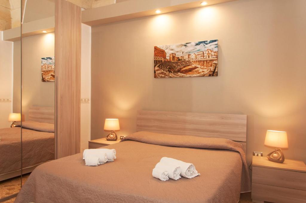 Postel nebo postele na pokoji v ubytování Wish Rooms Lecce