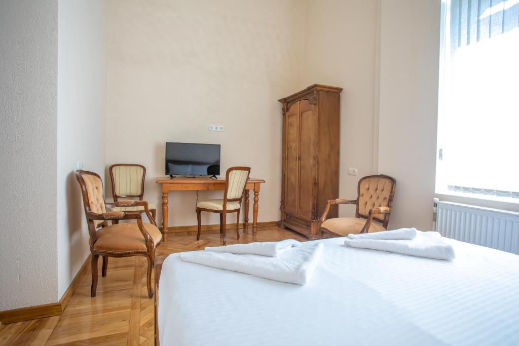 Postel nebo postele na pokoji v ubytování HOTEL VENETO