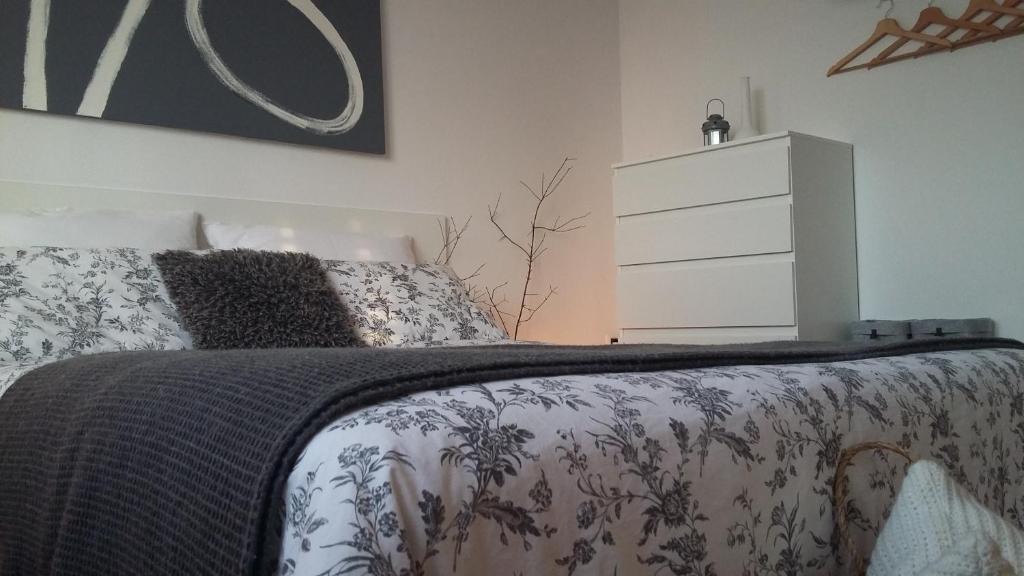 a bedroom with a bed with a dresser in it at ZARA APARTMENT in Banjole