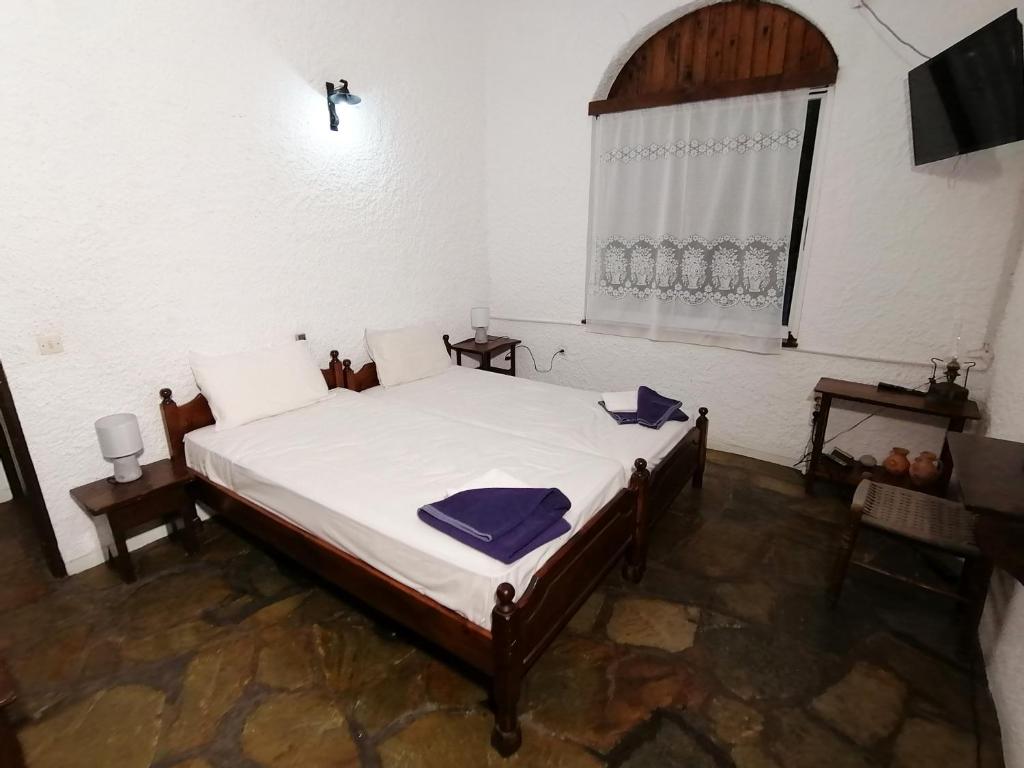 Postel nebo postele na pokoji v ubytování Vasilaras Hotel