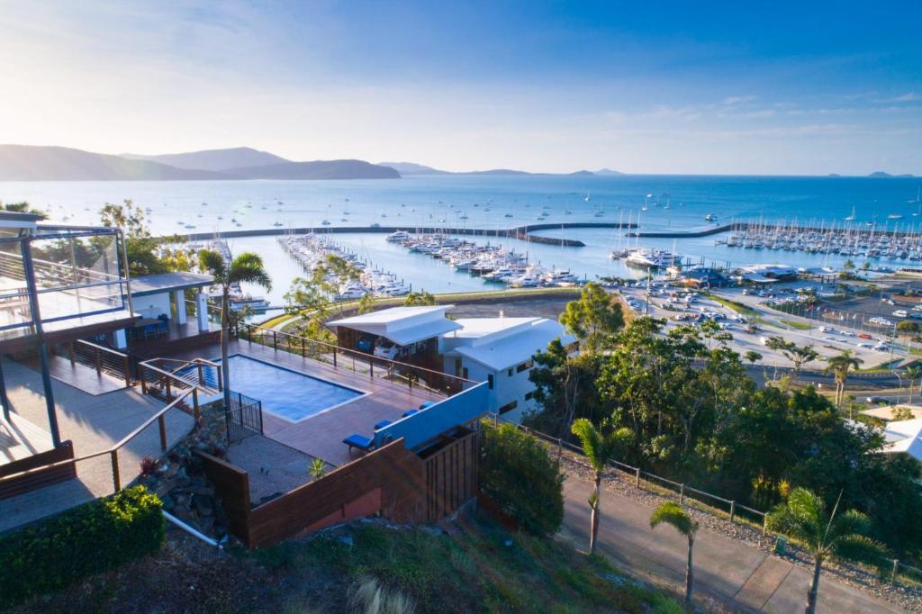 an aerial view of a house with a marina at Nautilus On The Hill - Airlie Beach in Airlie Beach
