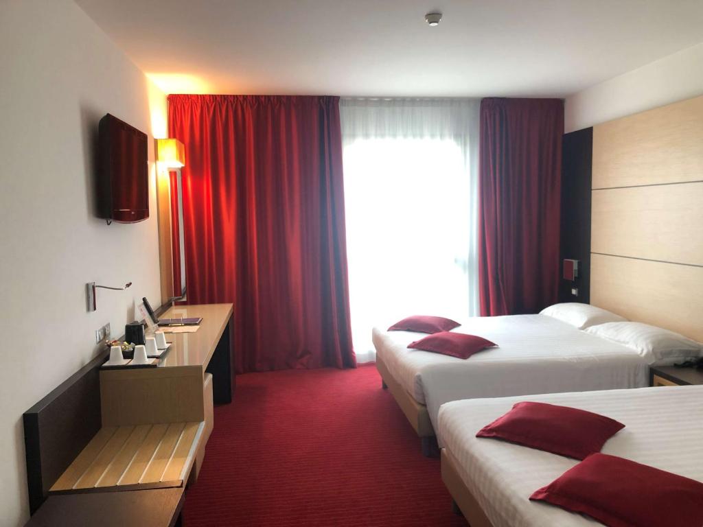 Postel nebo postele na pokoji v ubytování Best Western Plus Hotel Galileo Padova
