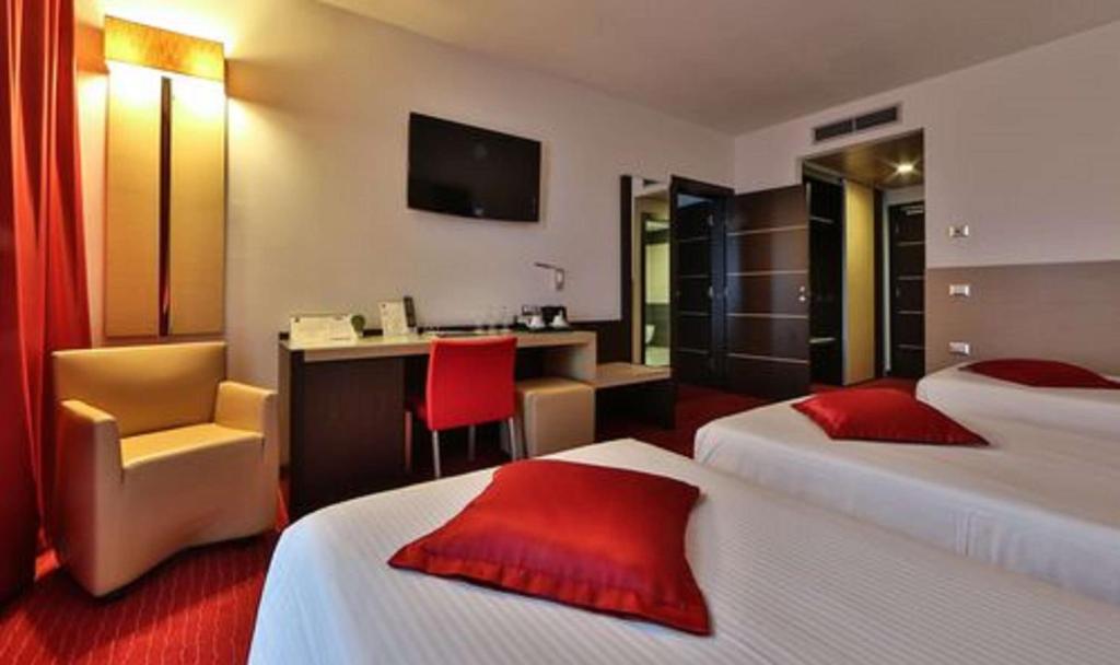 Postel nebo postele na pokoji v ubytování Best Western Plus Hotel Galileo Padova