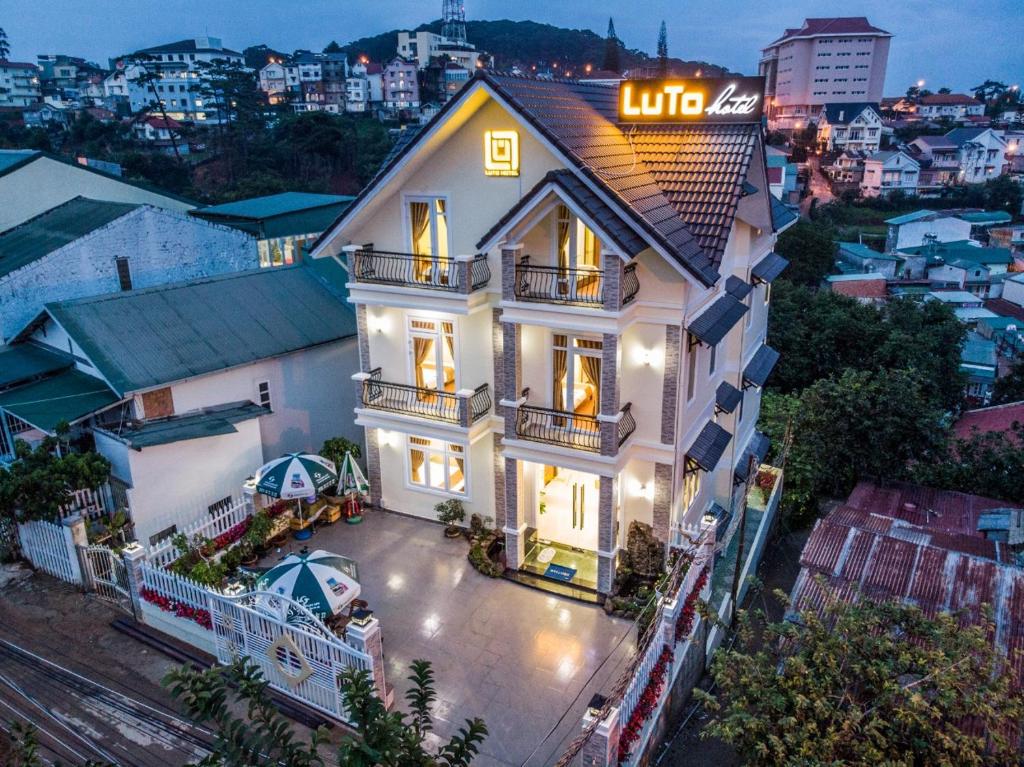 an aerial view of a house with lights on at LuTo Hotel in Da Lat