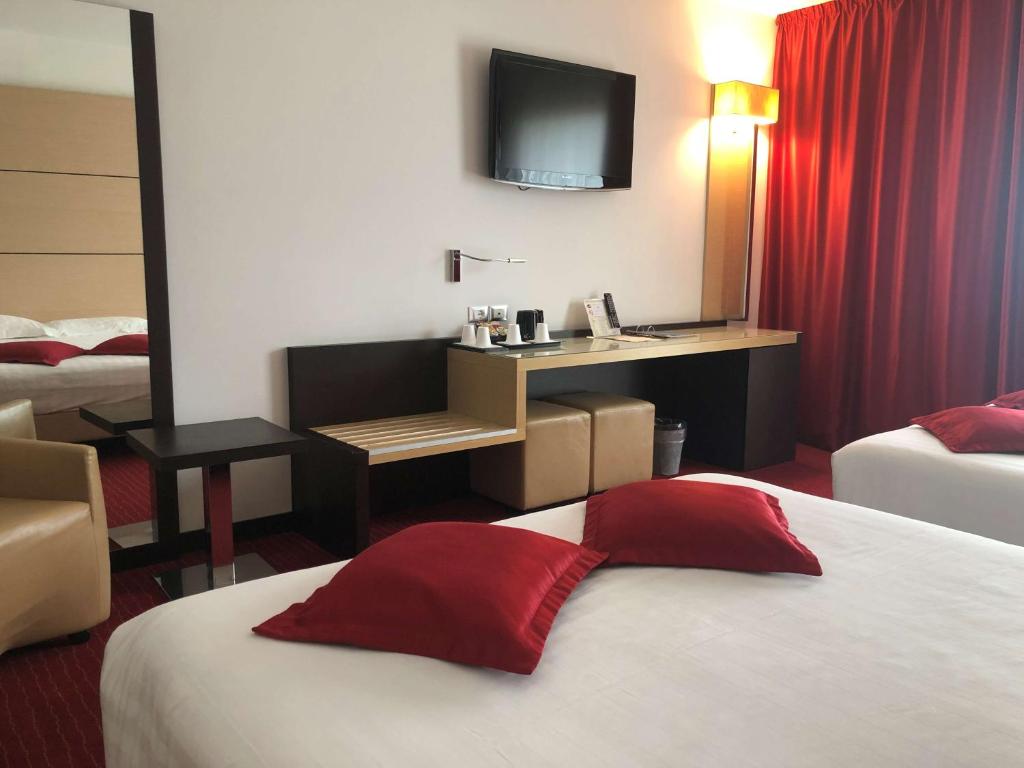 Postel nebo postele na pokoji v ubytování Best Western Plus Hotel Galileo Padova