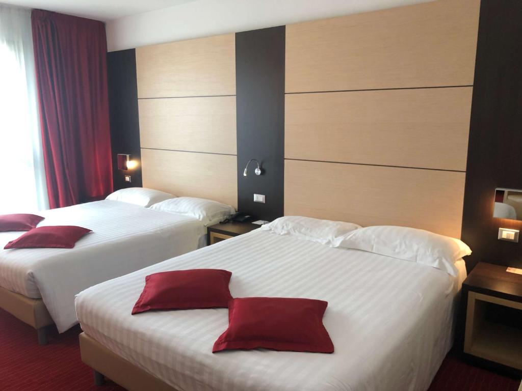 Postel nebo postele na pokoji v ubytování Best Western Plus Hotel Galileo Padova