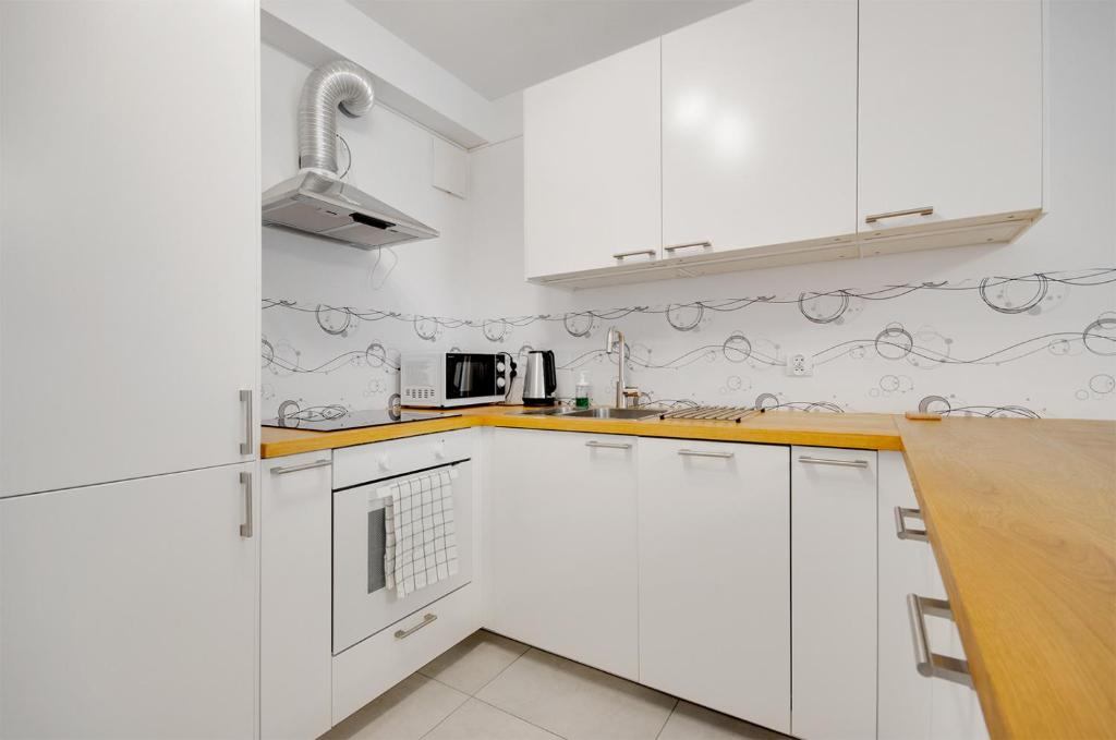 Kuchyň nebo kuchyňský kout v ubytování Apartment Kordiana