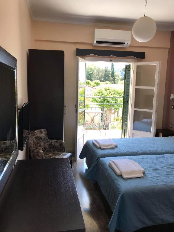 A bed or beds in a room at Villa Vasso