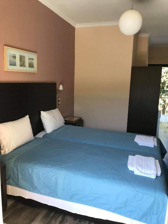 A bed or beds in a room at Villa Vasso
