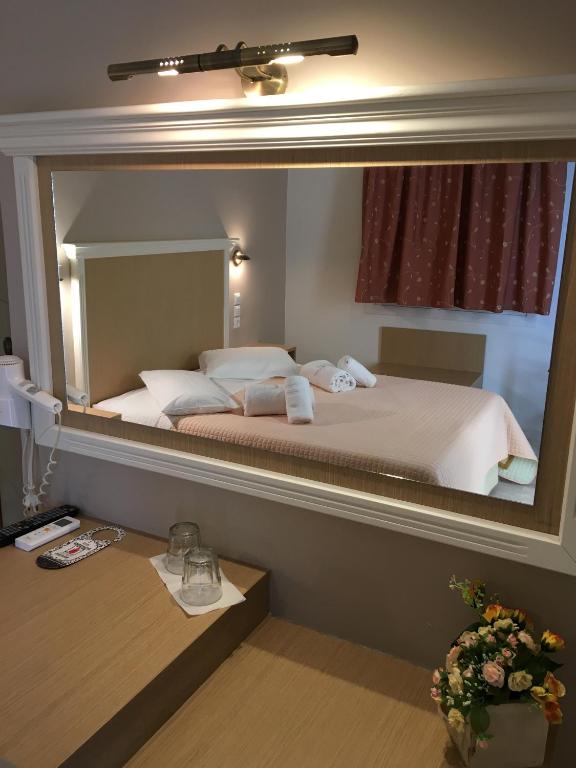 Postel nebo postele na pokoji v ubytování Hotel Avra