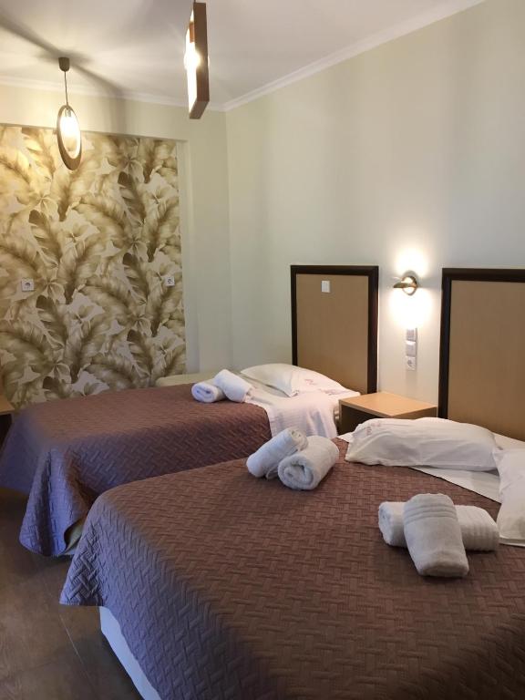 Postel nebo postele na pokoji v ubytování Hotel Avra